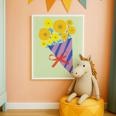 Framed floral bouquet print in a bright playroom with pops of color and whimsical decor