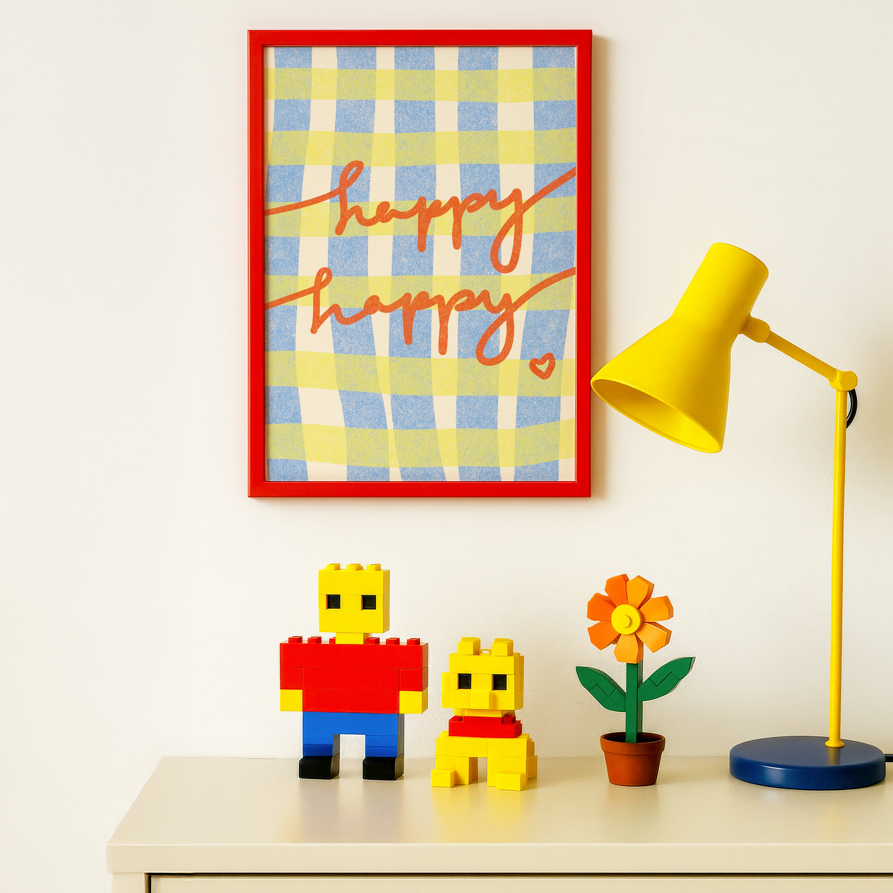 Framed colorful, optimistic artwork in a brightly-colored children's room