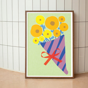 Framed artwork of a colorful bouquet with yellow flowers and a red bow on a light green background.